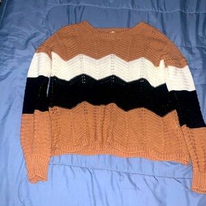 Black, Brown, and White Sweaters